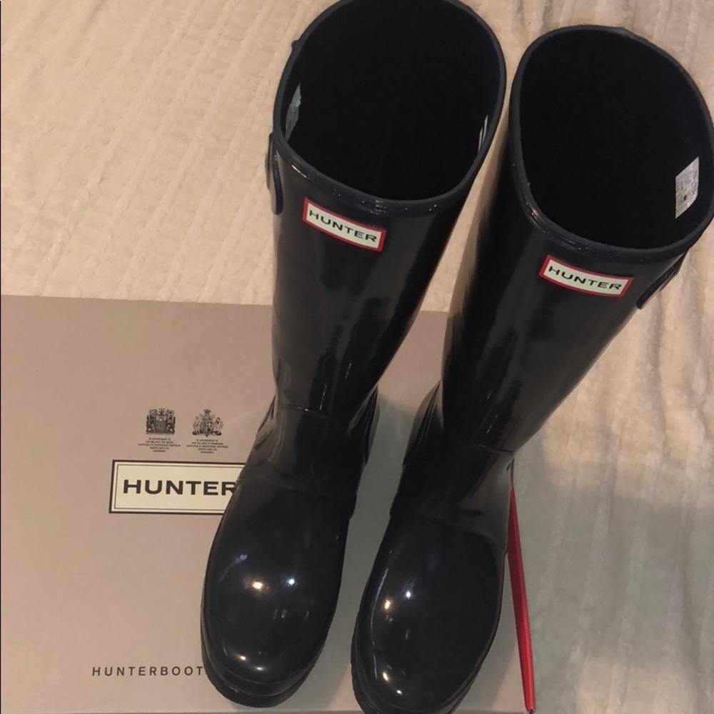 never worn navy gloss hunter rain boots with box!